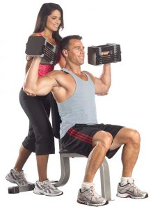 PowerBlock Elite adjustable dumbbells being used by couple