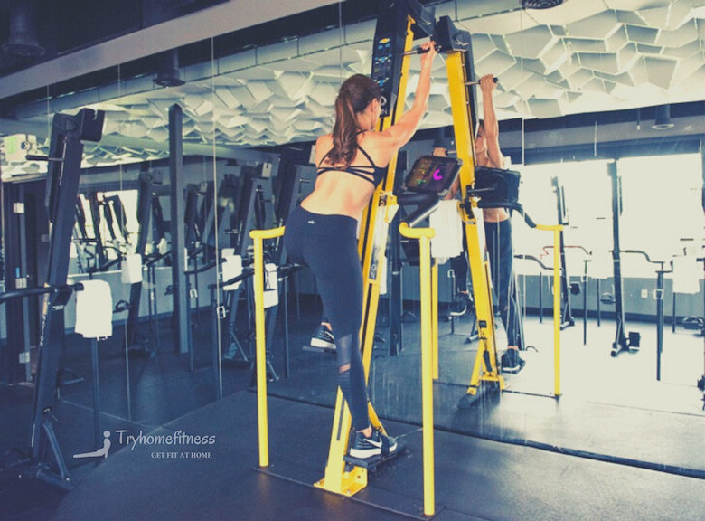 girl using a vertical climber exerciser, the Versaclimber