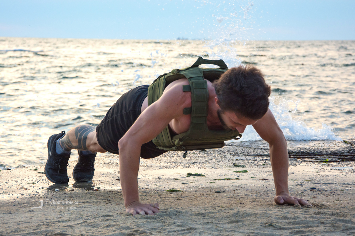 Man wearing weighted vest exercising