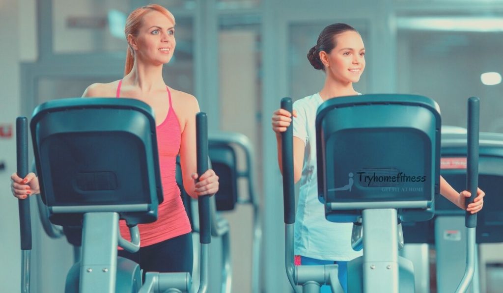 Mother & daughter on elliptical machines
